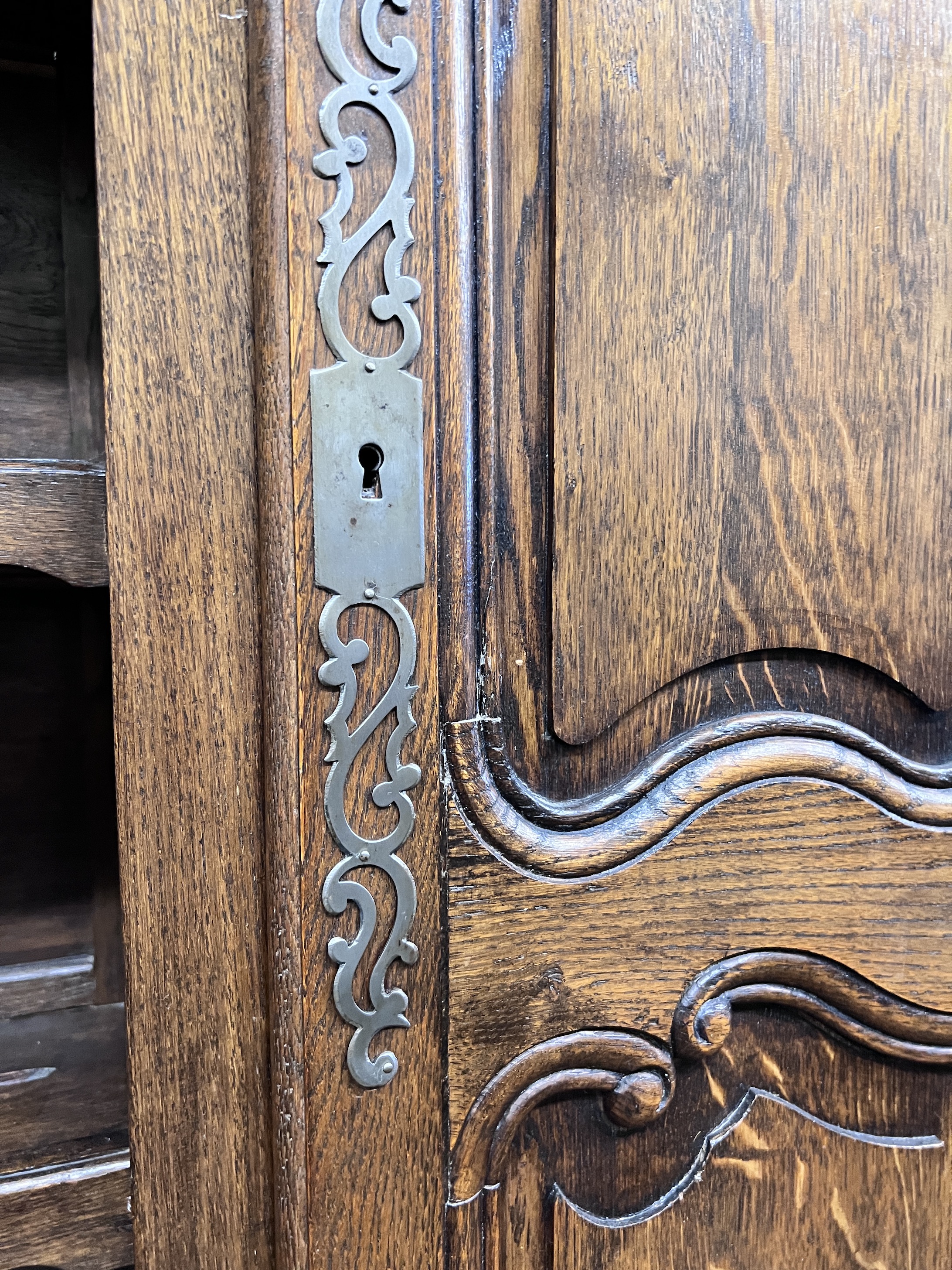 An 18th century style French oak dresser, width 180cm, height 225cm